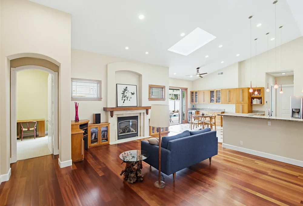 Living room with fireplace and cherry hardwood floors